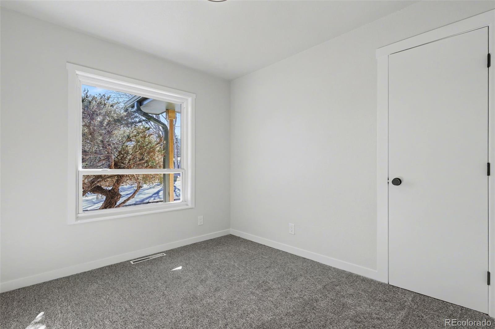 1002 Milky Way Colorado Springs, CO 80905 - Photo 18 of 39 an empty room with a window