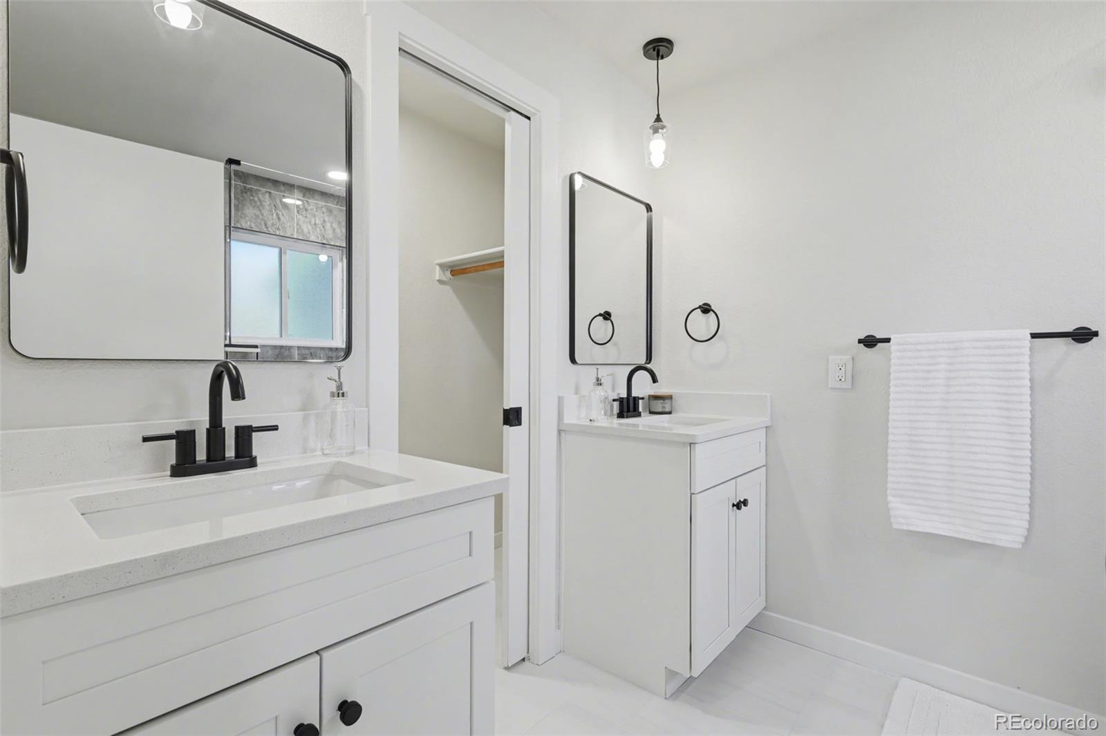 1002 Milky Way Colorado Springs, CO 80905 - Photo 21 of 39 a bathroom with a sink and a mirror