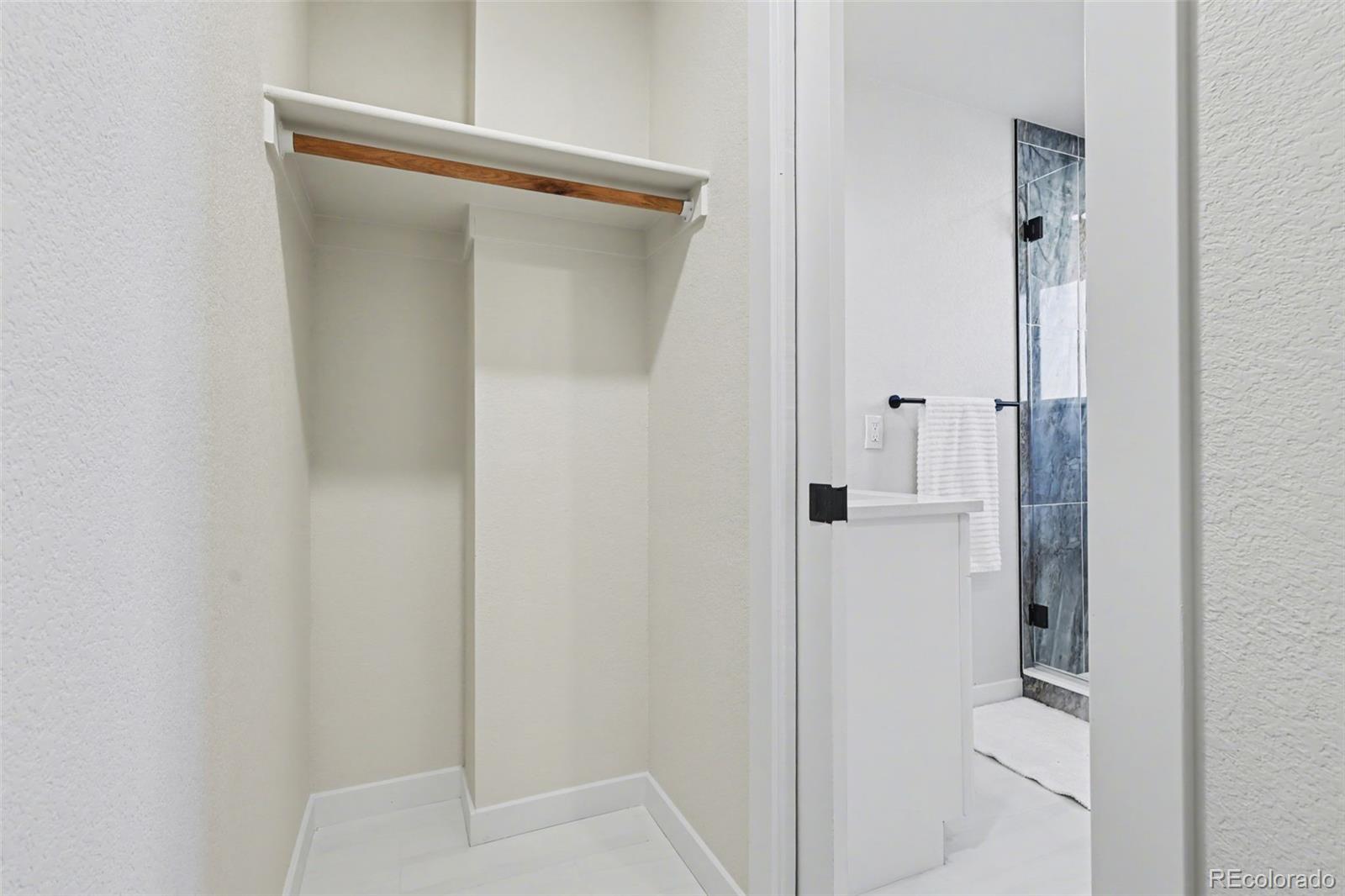 1002 Milky Way Colorado Springs, CO 80905 - Photo 22 of 39 a bathroom with a glass shower door