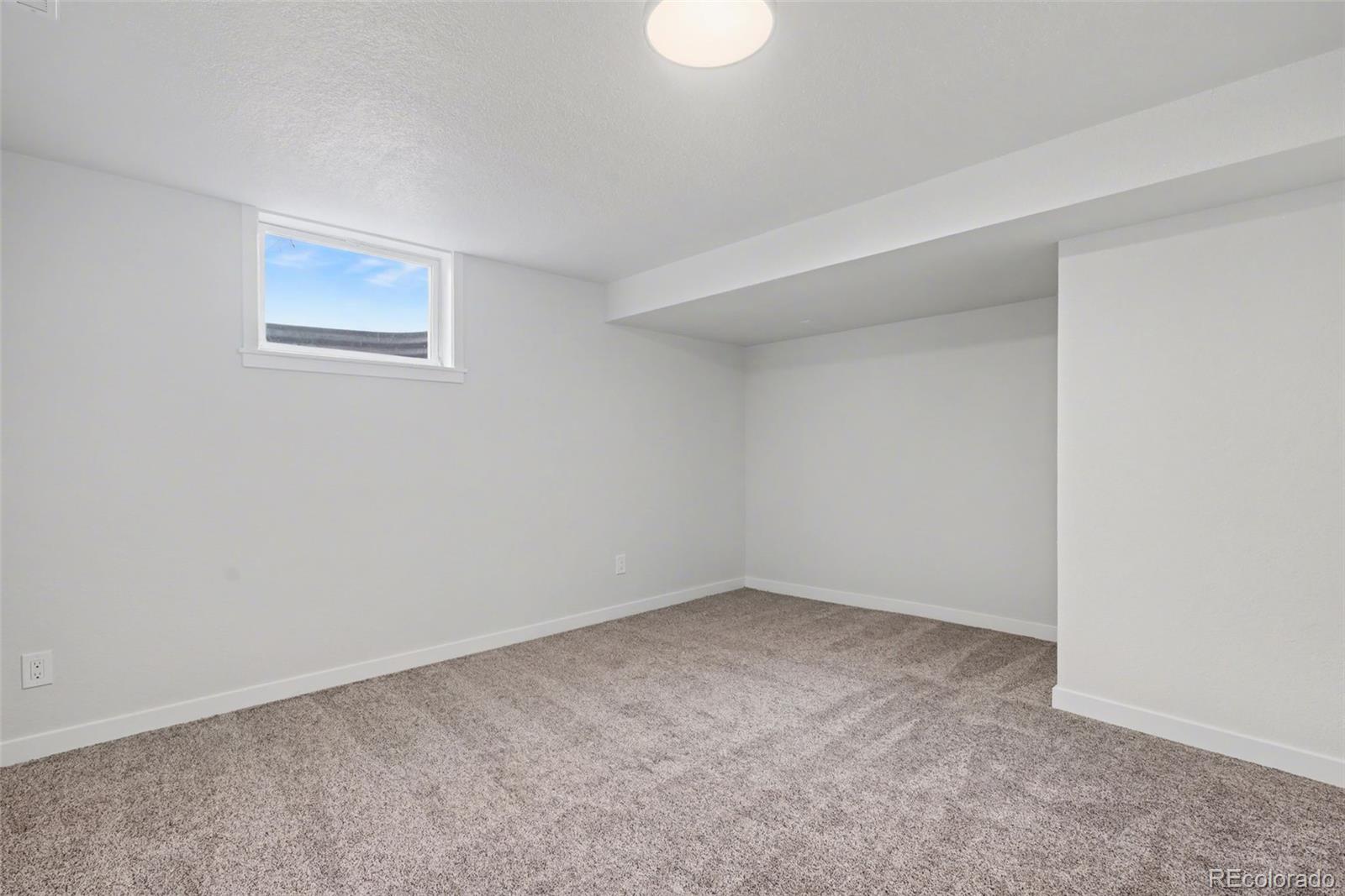 1002 Milky Way Colorado Springs, CO 80905 - Photo 29 of 39 a view of an empty room with a window