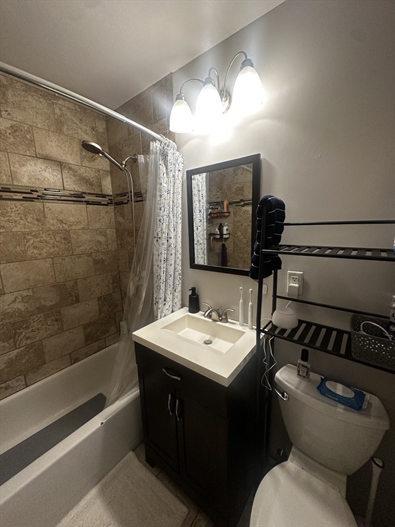 199 Athens Street, Unit 3 Boston, MA 02127 - Photo 11 of 18 a bathroom with a sink toilet and shower