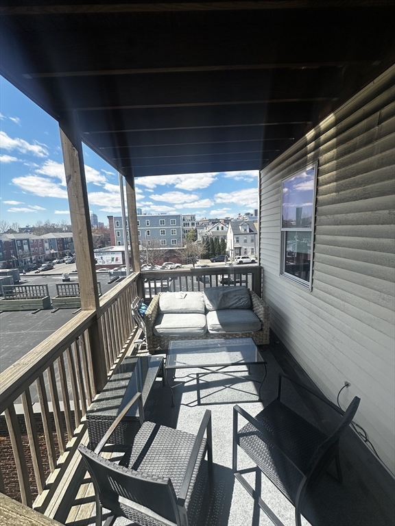 199 Athens Street, Unit 3 Boston, MA 02127 - Photo 18 of 18 a view of a chairs and table in the balcony