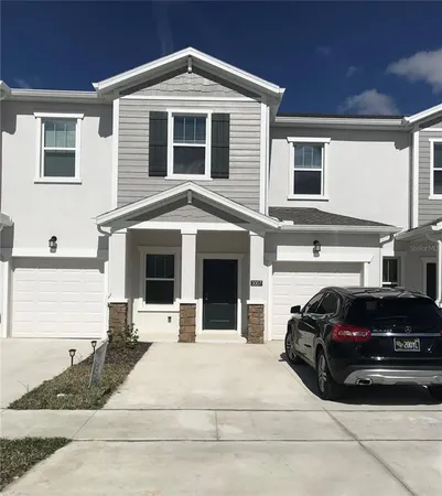 a view of a car parked in front of a house