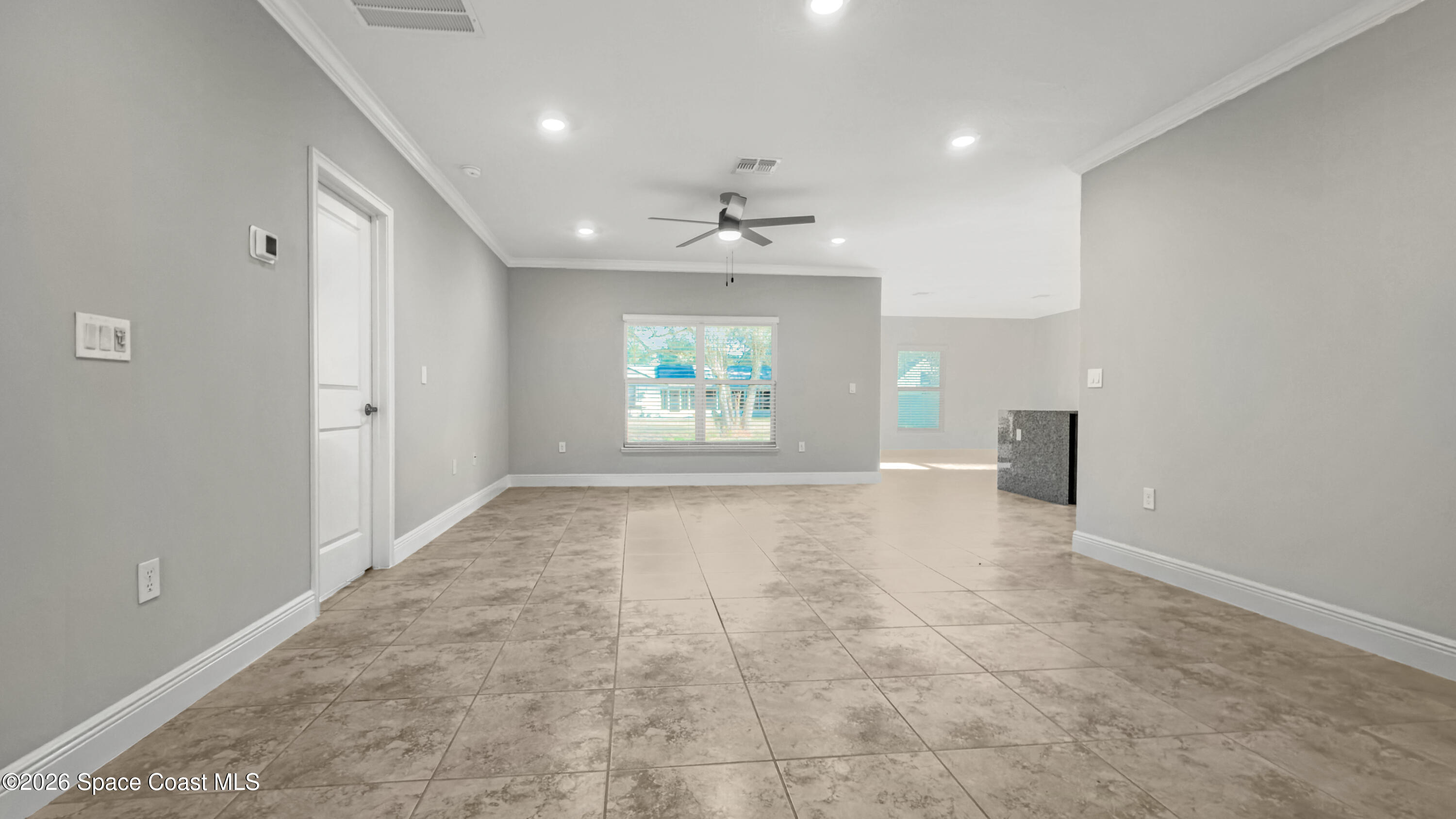 594 Bayharbor Terrace Sebastian, FL 32958 - Photo 12 of 34 an empty room with windows and ceiling fan