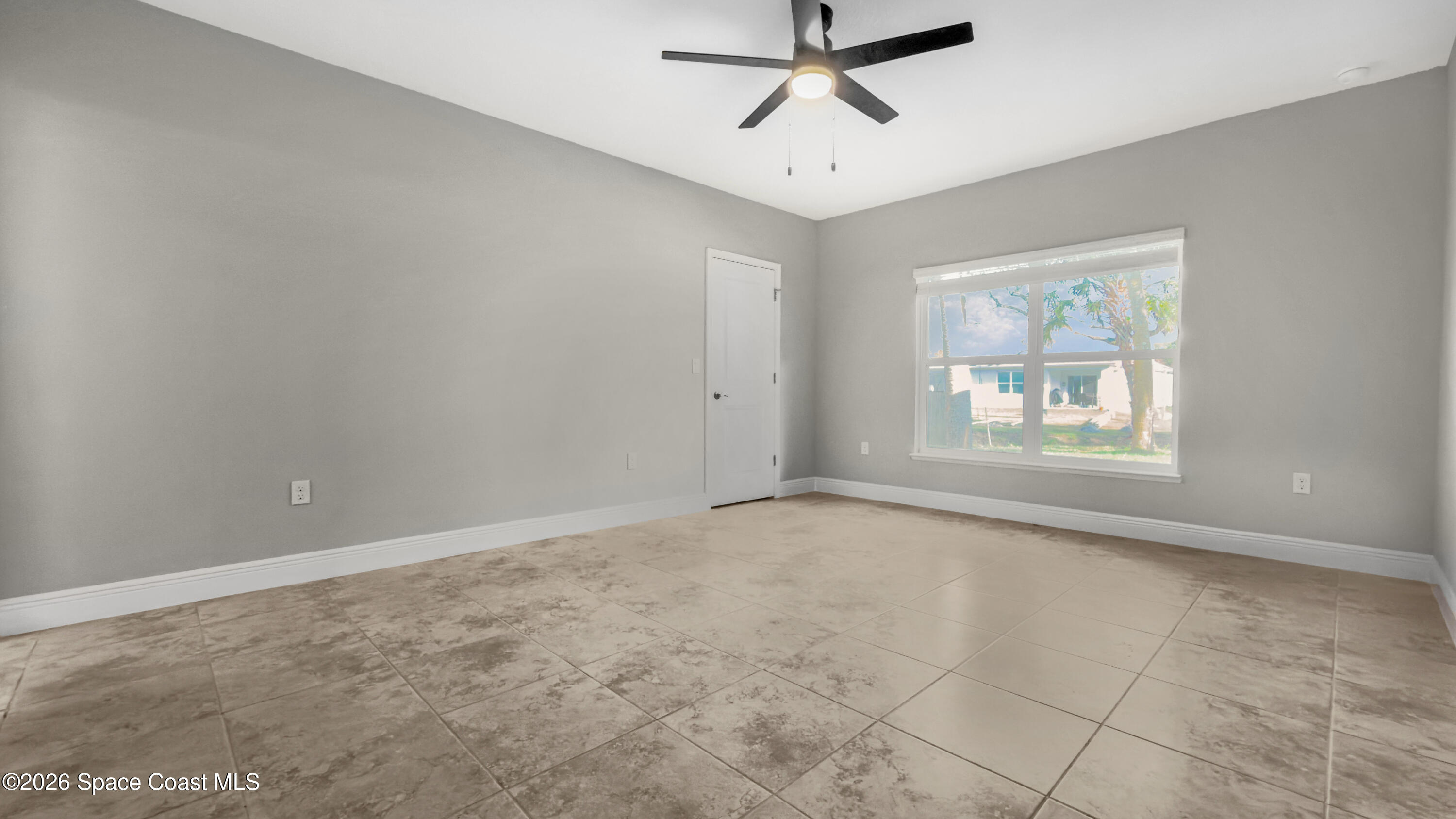 594 Bayharbor Terrace Sebastian, FL 32958 - Photo 13 of 34 an empty room with windows and fan