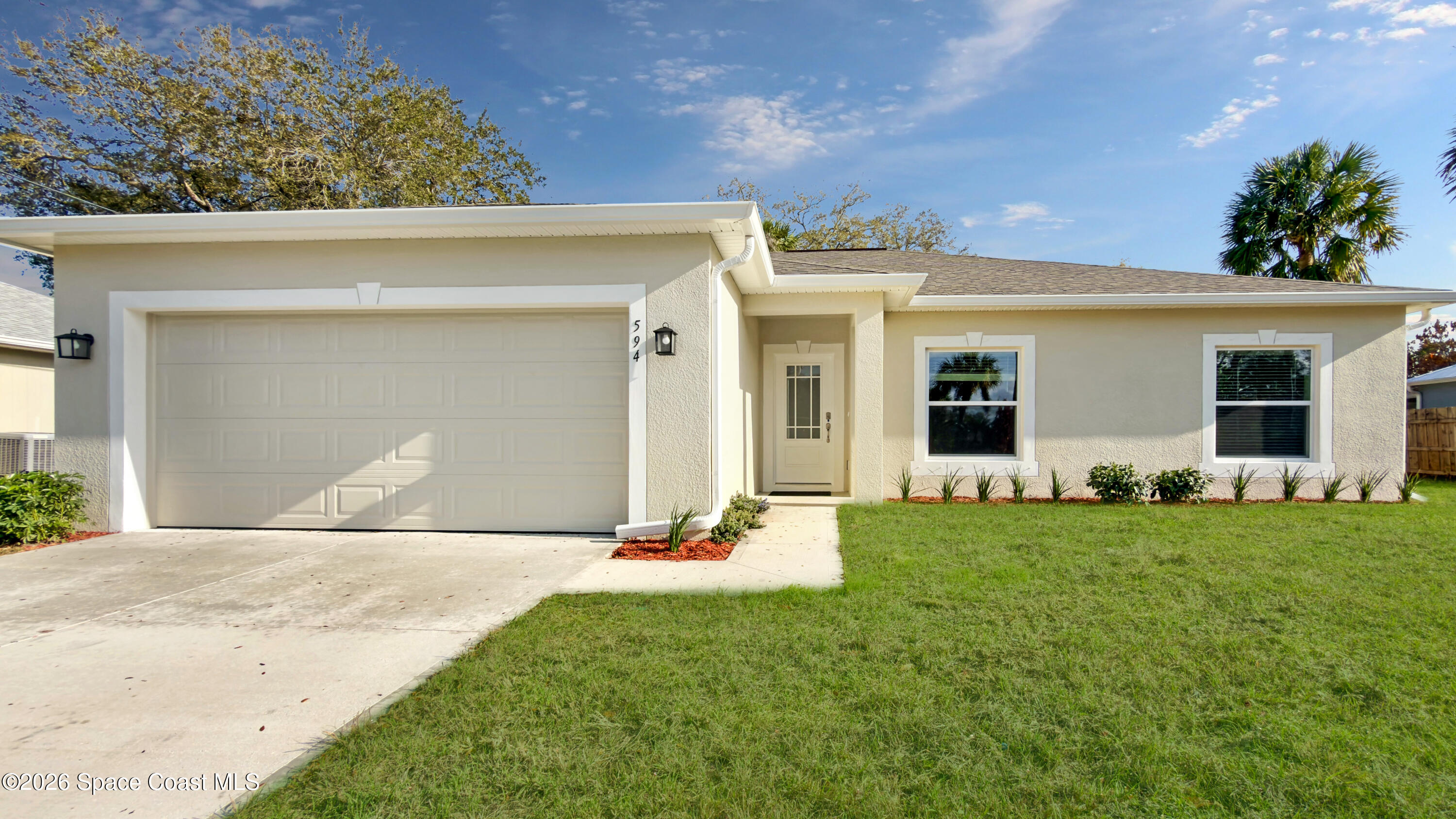 594 Bayharbor Terrace Sebastian, FL 32958 - Photo 26 of 34 a front view of a house with a yard