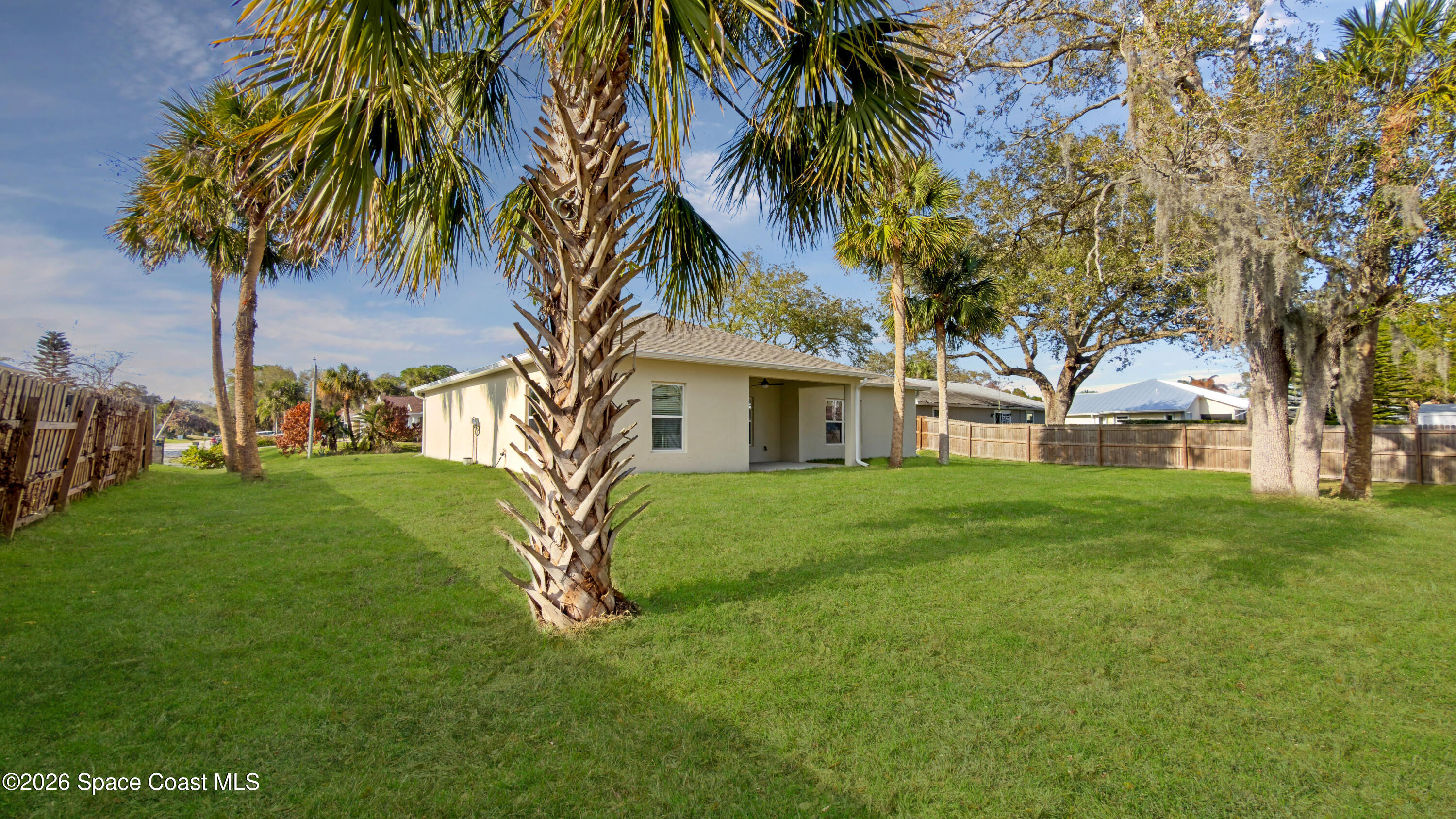594 Bayharbor Terrace Sebastian, FL 32958 - Photo 31 of 34 a view of a house with a yard