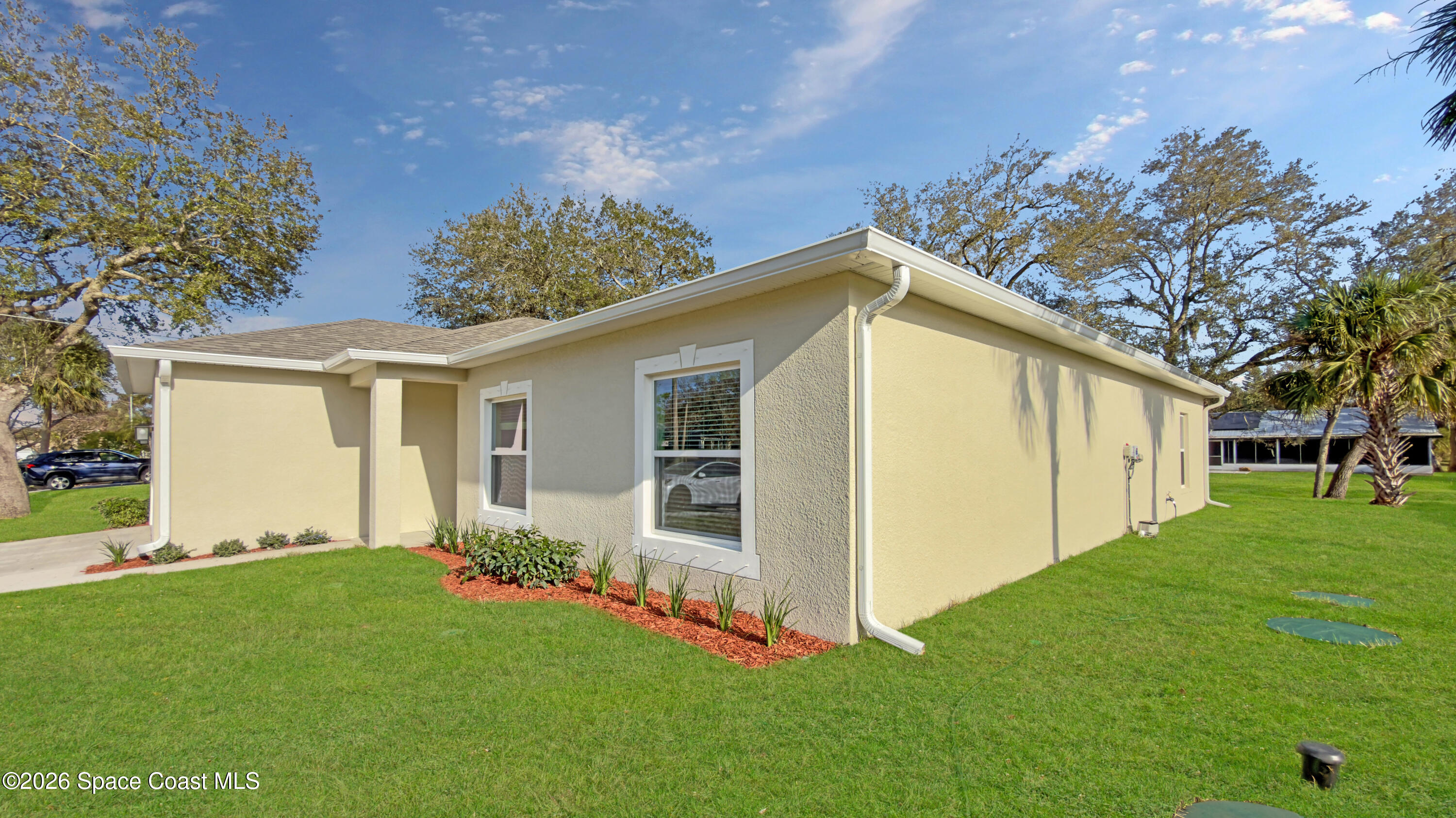 594 Bayharbor Terrace Sebastian, FL 32958 - Photo 33 of 34 a view of a house with backyard and garden