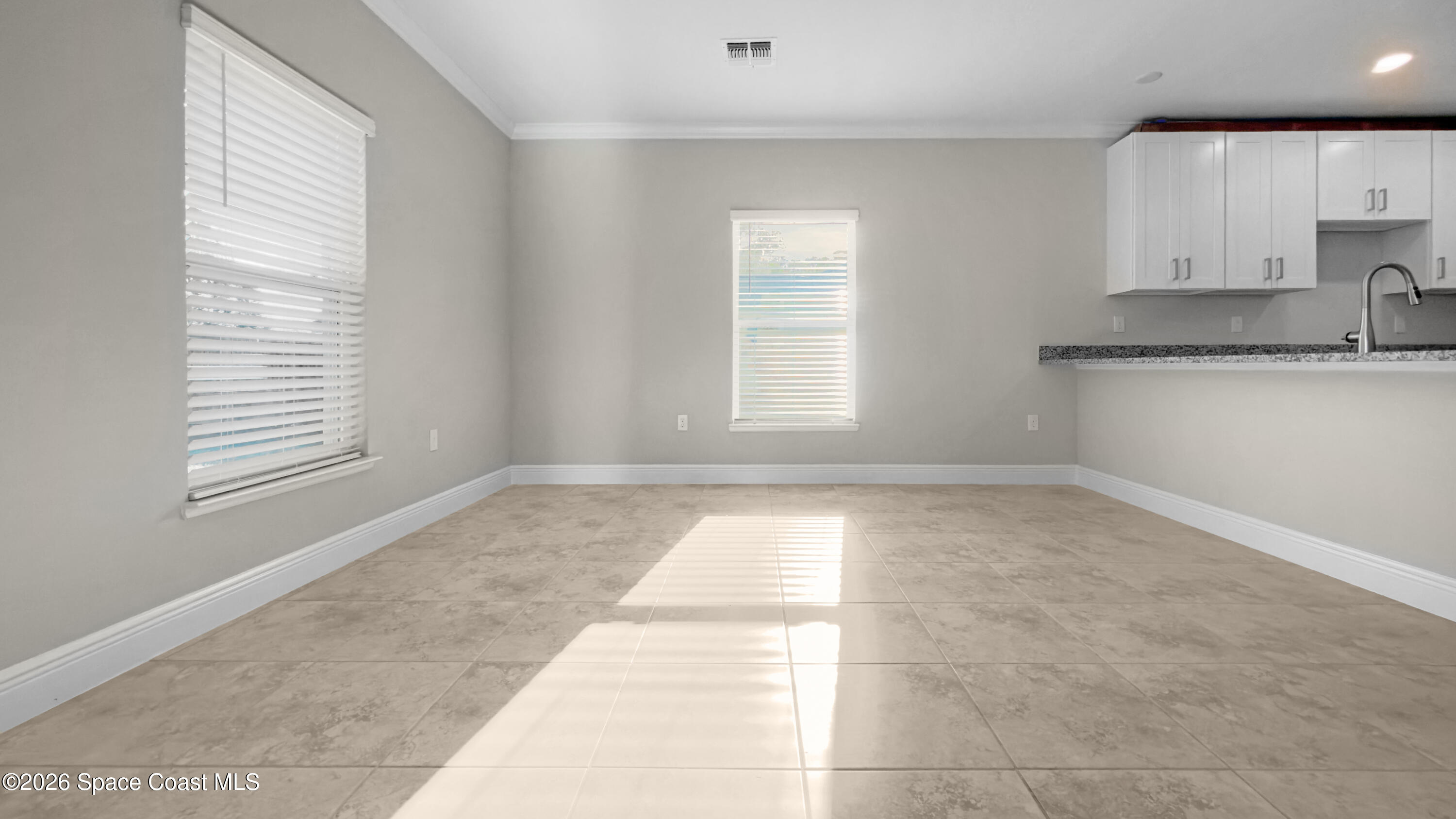 594 Bayharbor Terrace Sebastian, FL 32958 - Photo 5 of 34 a view of a kitchen with a sink and windows