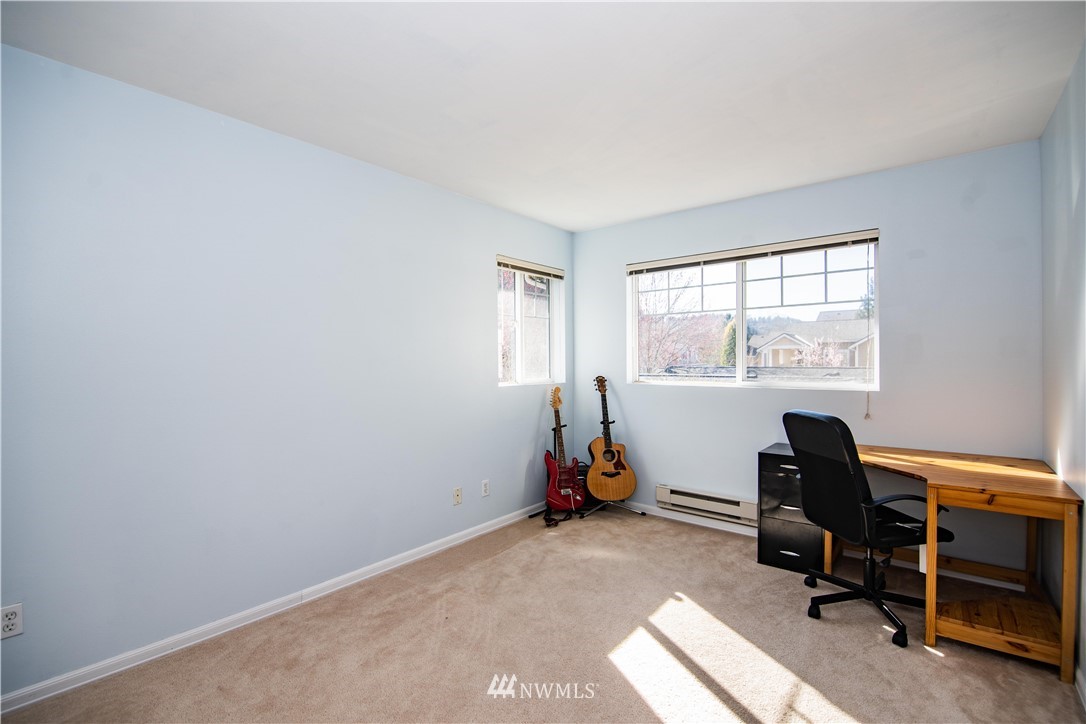15150 140th Way Southeast, Unit G104 Renton, WA 98058 - Photo 13 of 24 a view of a workspace with furniture and a window