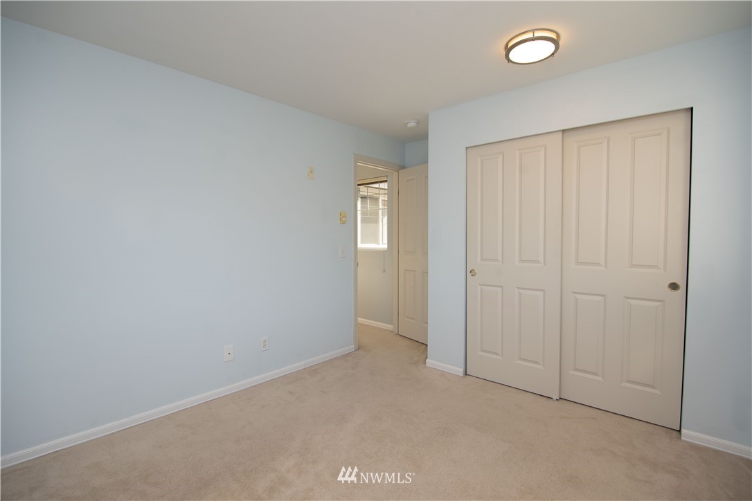 15150 140th Way Southeast, Unit G104 Renton, WA 98058 - Photo 17 of 24 an empty room with windows