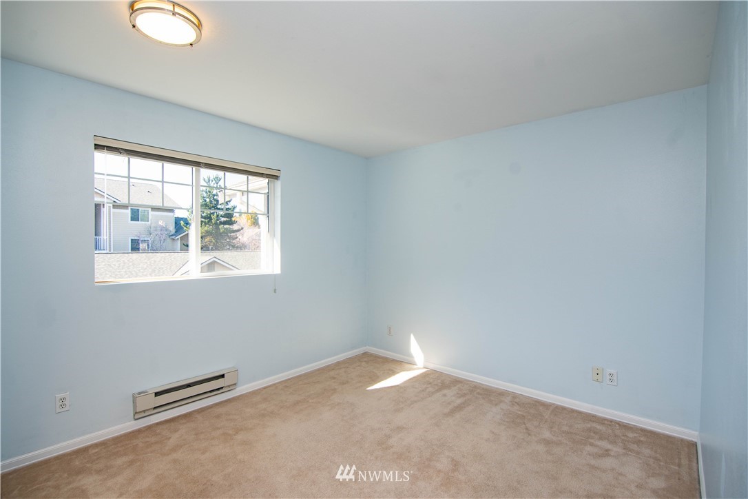 15150 140th Way Southeast, Unit G104 Renton, WA 98058 - Photo 18 of 24 an empty room with a window