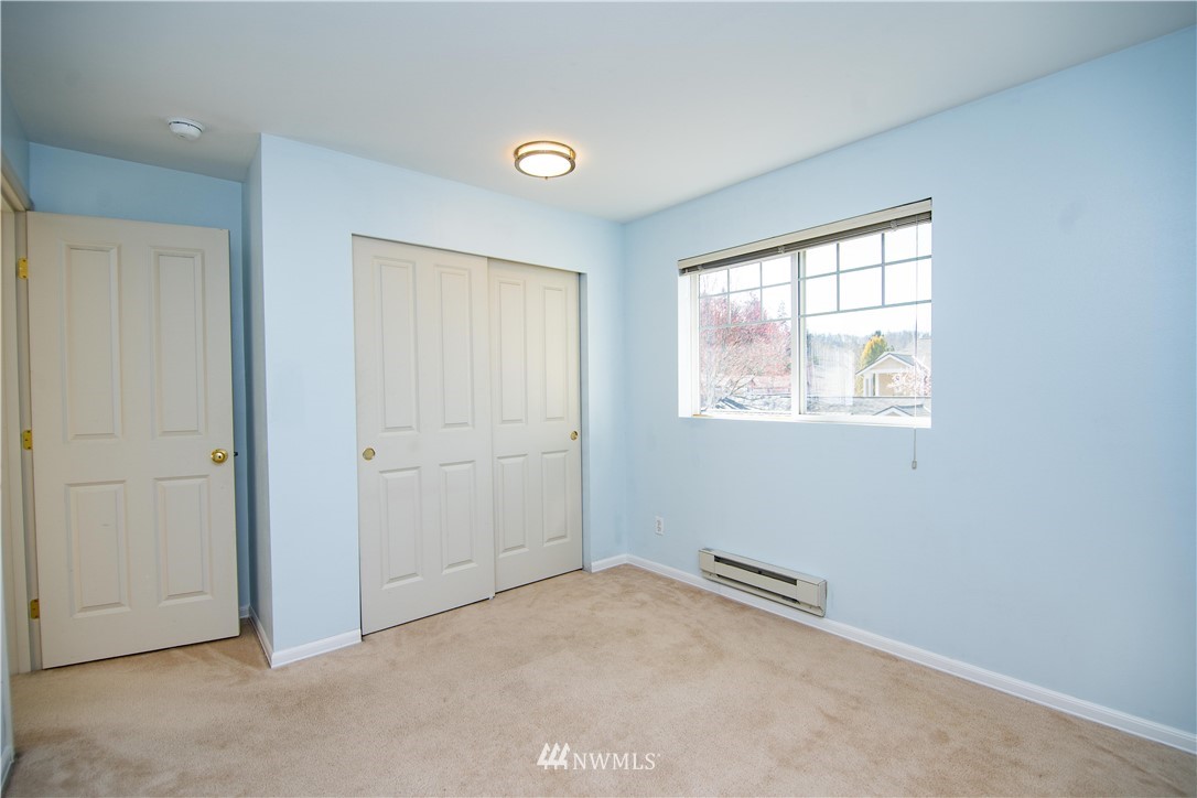 15150 140th Way Southeast, Unit G104 Renton, WA 98058 - Photo 19 of 24 an empty room with windows