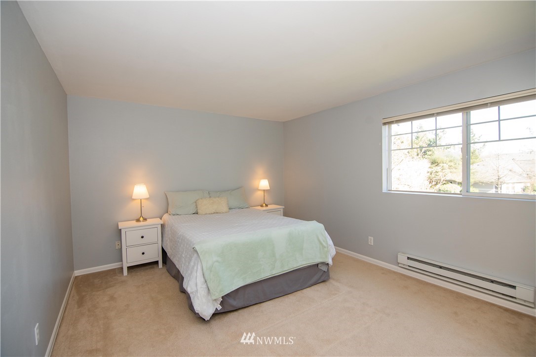 15150 140th Way Southeast, Unit G104 Renton, WA 98058 - Photo 10 of 24 a bedroom with a bed and window