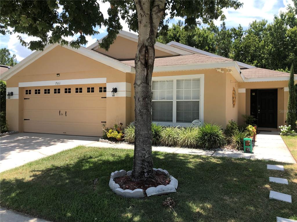 701 Sandy Ridge Drive Davenport, FL 33896 - Photo 1 of 1 a front view of a house with a yard