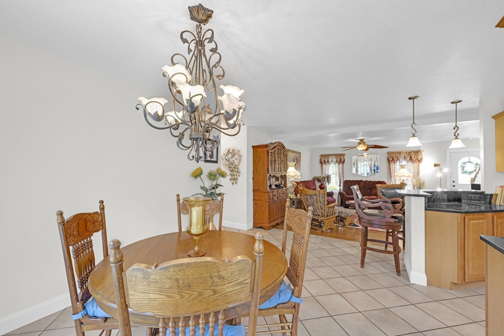 12 Malboeuf Road Ware, MA 01082 - Photo 12 of 42 a dining room filled with lots of tables a chandelier and kitchen view