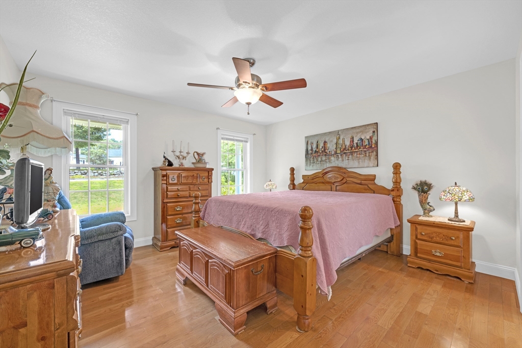 12 Malboeuf Road Ware, MA 01082 - Photo 14 of 42 a bedroom with a bed next to a window with a flat screen tv