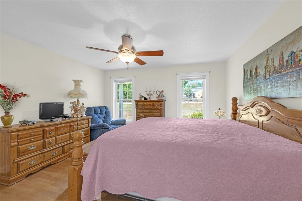 12 Malboeuf Road Ware, MA 01082 - Photo 16 of 42 a bedroom with a bed and a chandelier