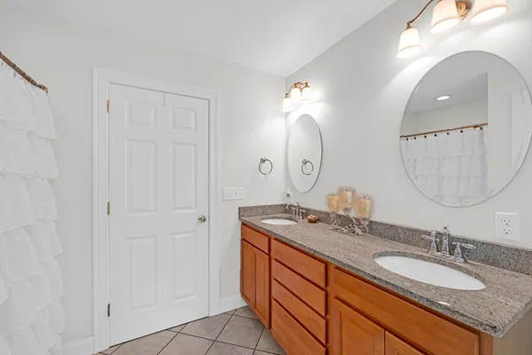 a bathroom with a bathtub and window