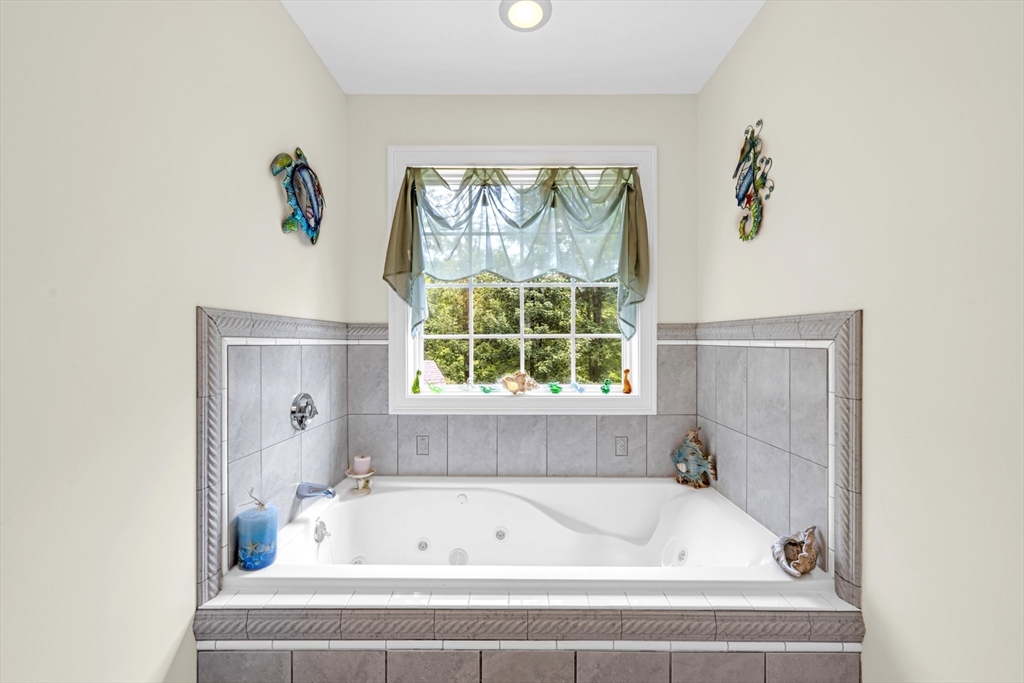 12 Malboeuf Road Ware, MA 01082 - Photo 19 of 42 a bathroom with a bathtub and window