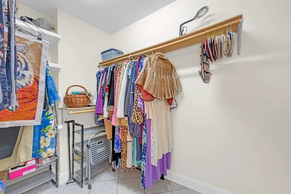 a view of an empty room and wooden floor