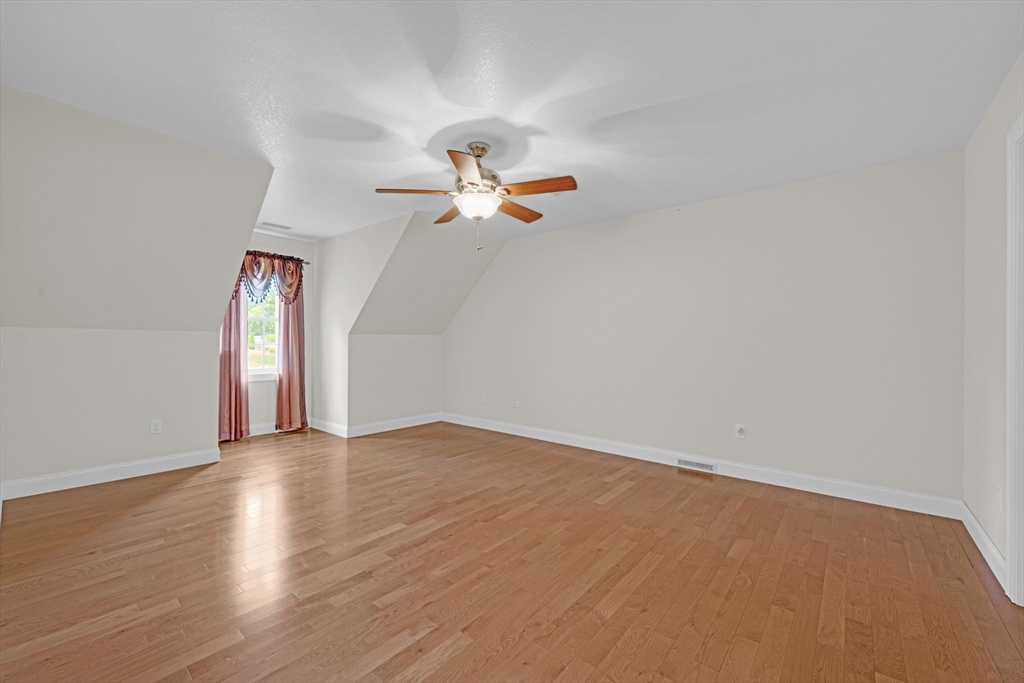 12 Malboeuf Road Ware, MA 01082 - Photo 24 of 42 an empty room with ceiling fan and window