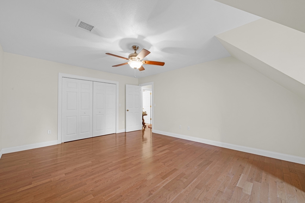 12 Malboeuf Road Ware, MA 01082 - Photo 26 of 42 a view of an empty room with wooden floor and a window