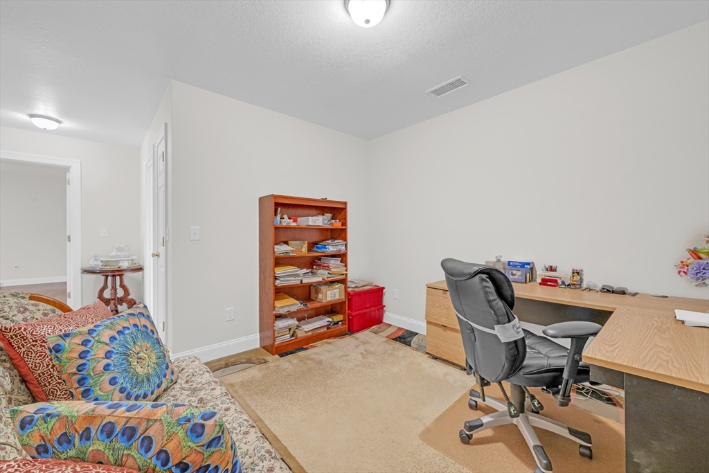 12 Malboeuf Road Ware, MA 01082 - Photo 28 of 42 a bedroom with a bed and wooden floor