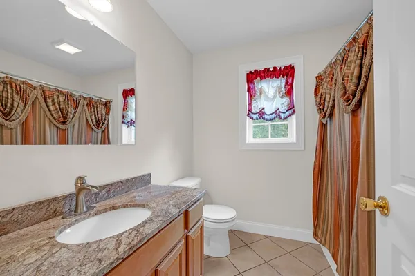 a view of a house with wooden deck