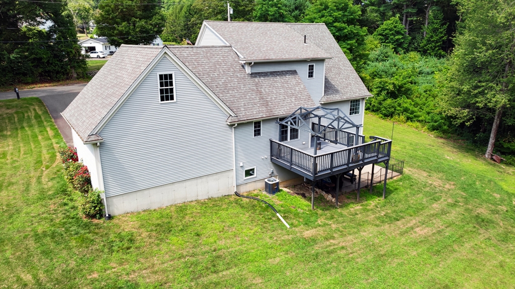 12 Malboeuf Road Ware, MA 01082 - Photo 37 of 42 a aerial view of a house with a yard table and chairs