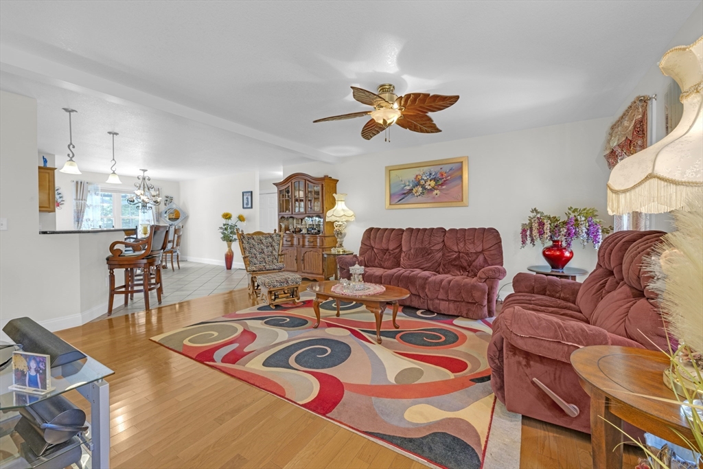 12 Malboeuf Road Ware, MA 01082 - Photo 6 of 42 a living room with furniture a rug and a chandelier