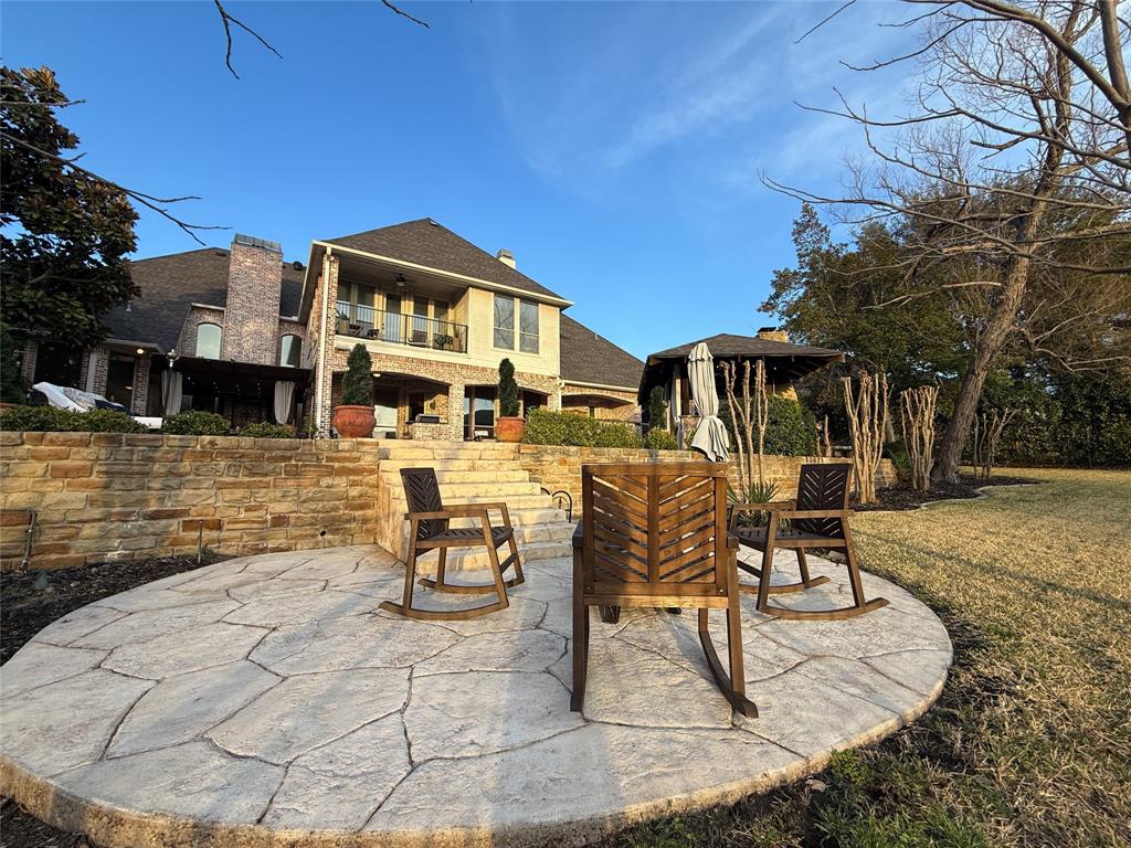 1919 Kings Pass Heath, TX 75032 - Photo 34 of 38 Patio / terrace featuring a patio area and a yard