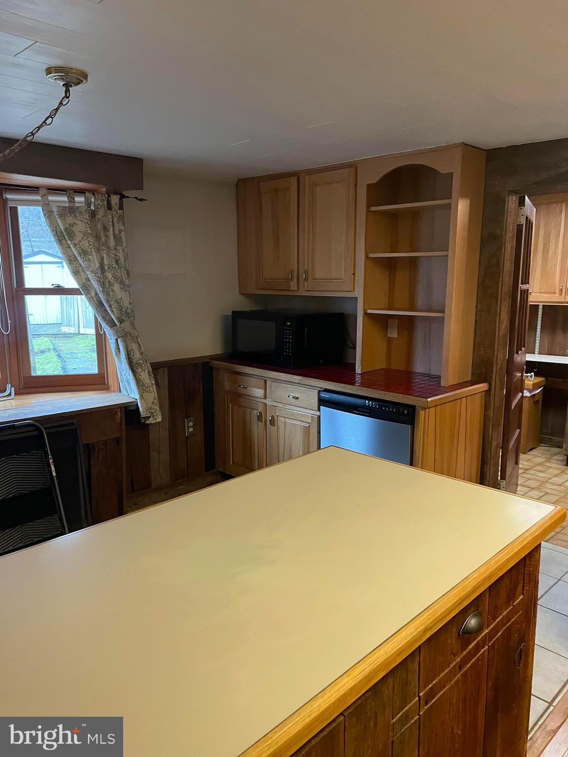 1127 Kaolin Road Avondale, PA 19311 - Photo 12 of 31 a kitchen with a cabinets and wooden floor