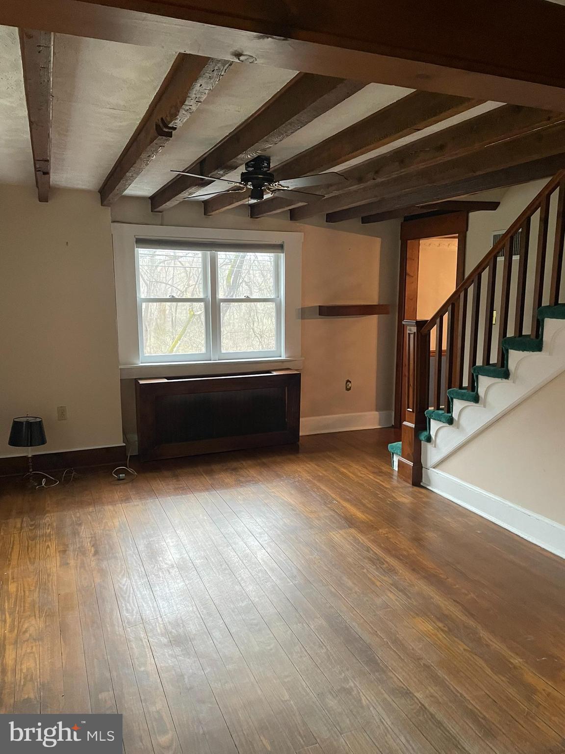 1127 Kaolin Road Avondale, PA 19311 - Photo 17 of 31 a view of an empty room with wooden floor and a window