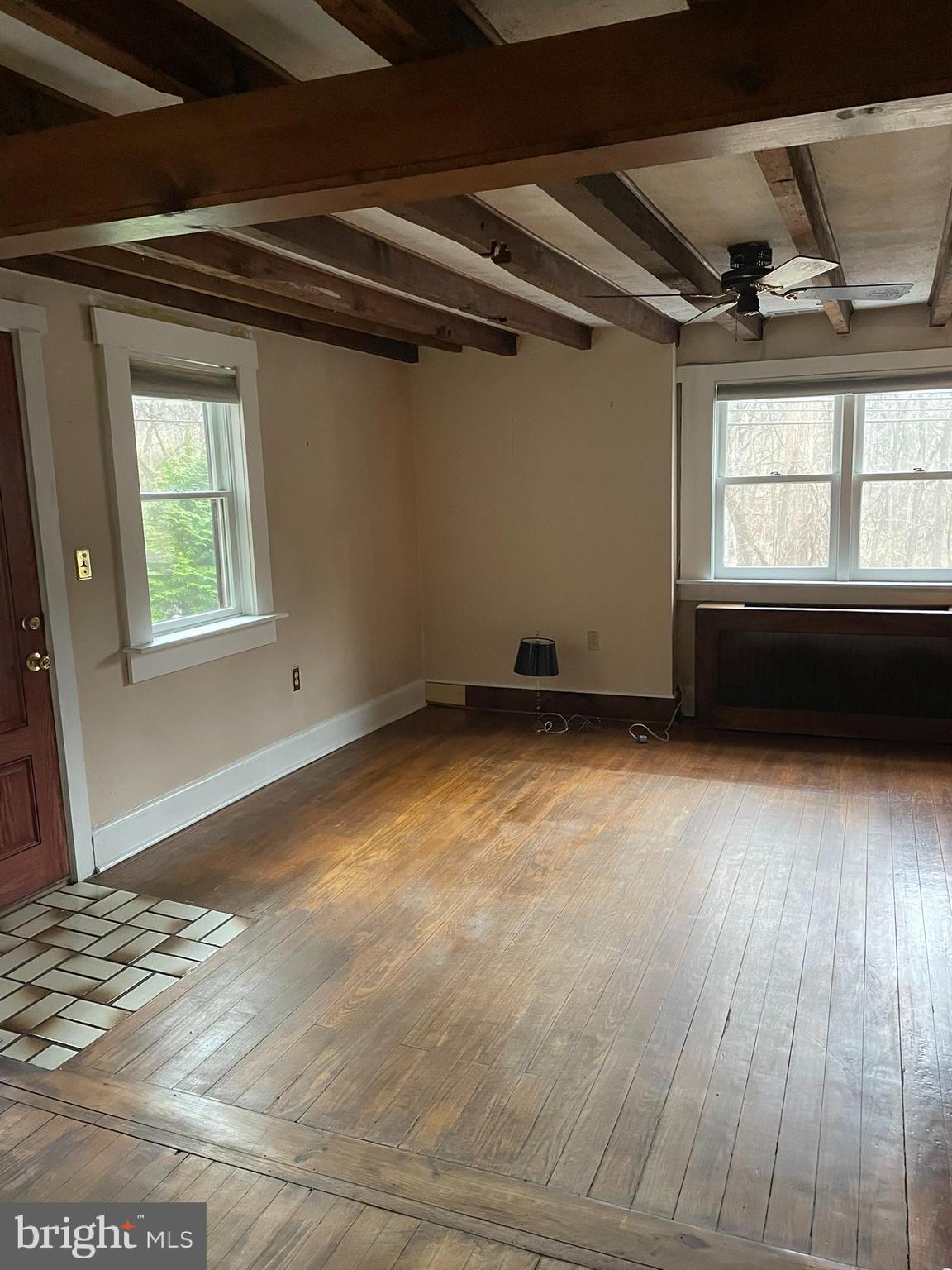 1127 Kaolin Road Avondale, PA 19311 - Photo 18 of 31 a view of empty room with wooden floor and fan
