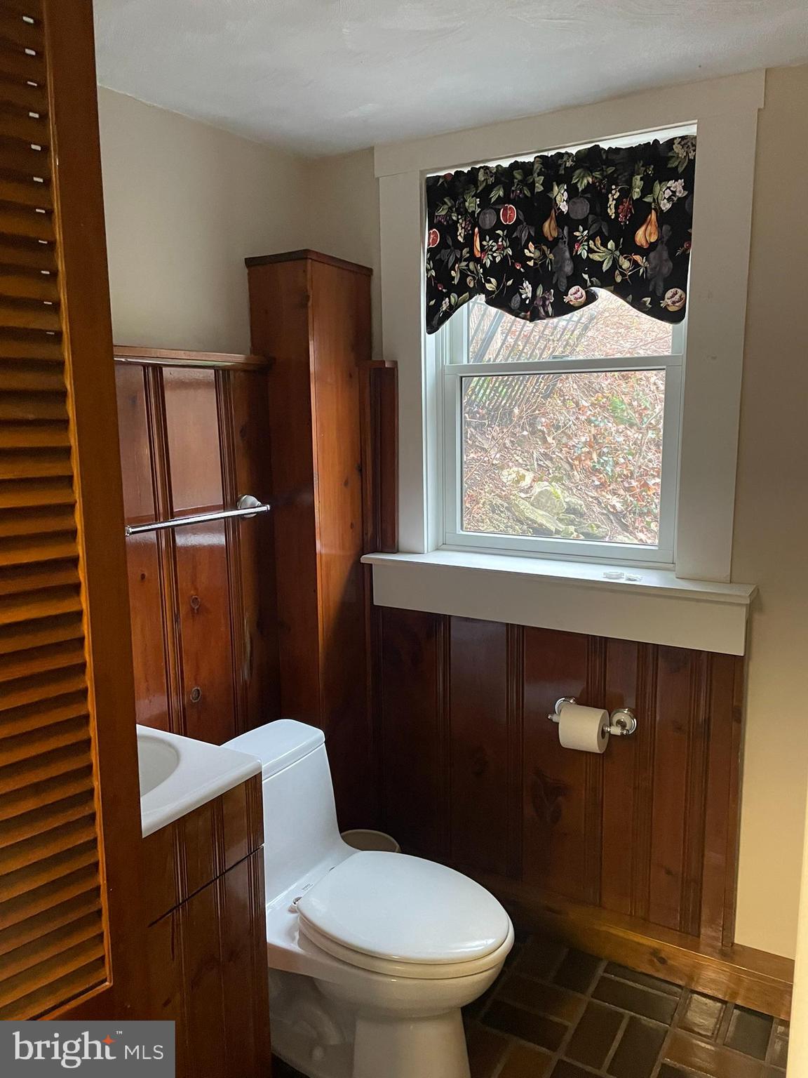1127 Kaolin Road Avondale, PA 19311 - Photo 21 of 31 a bathroom with a toilet a sink and window