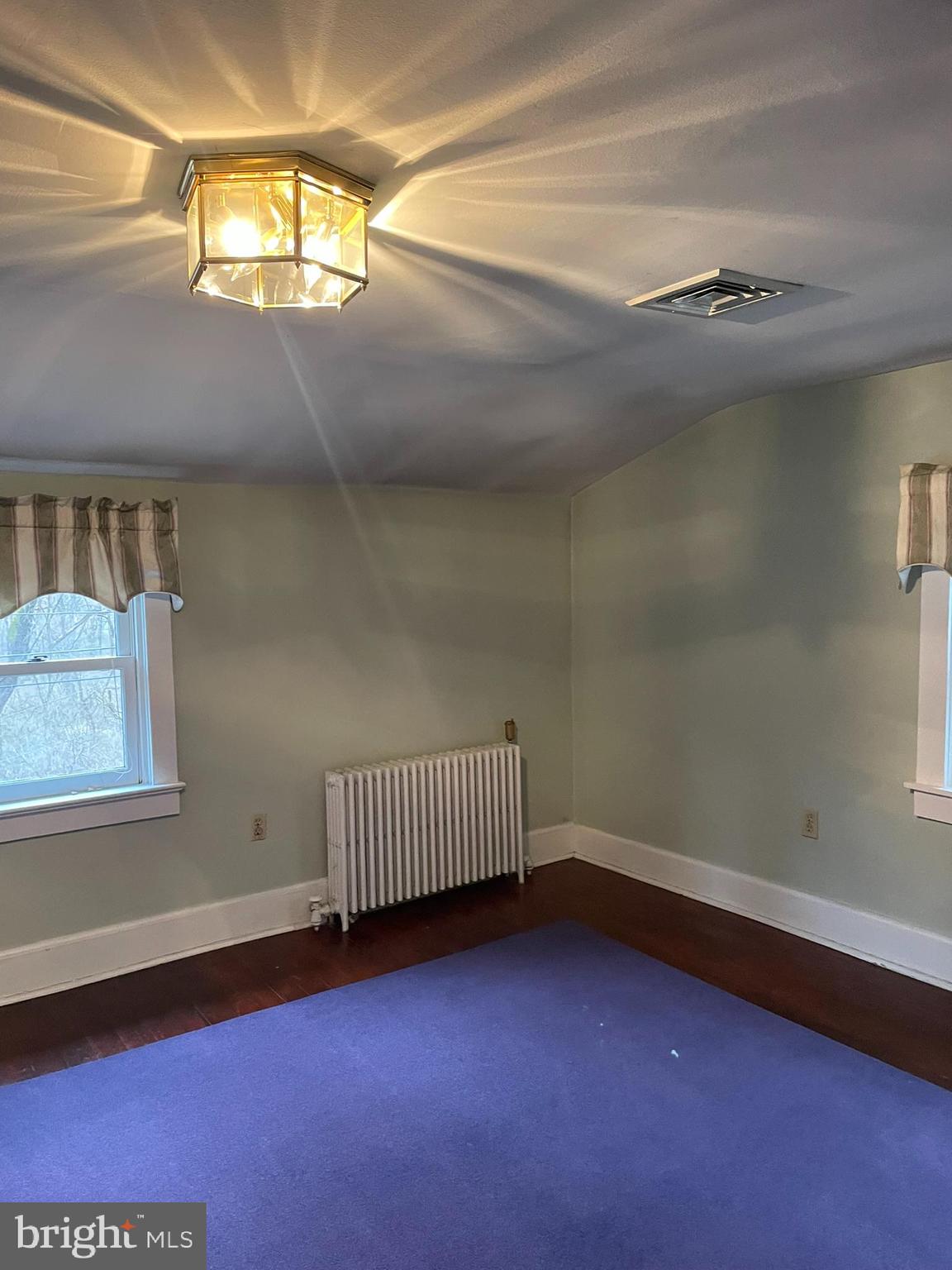 1127 Kaolin Road Avondale, PA 19311 - Photo 22 of 31 en empty room with windows