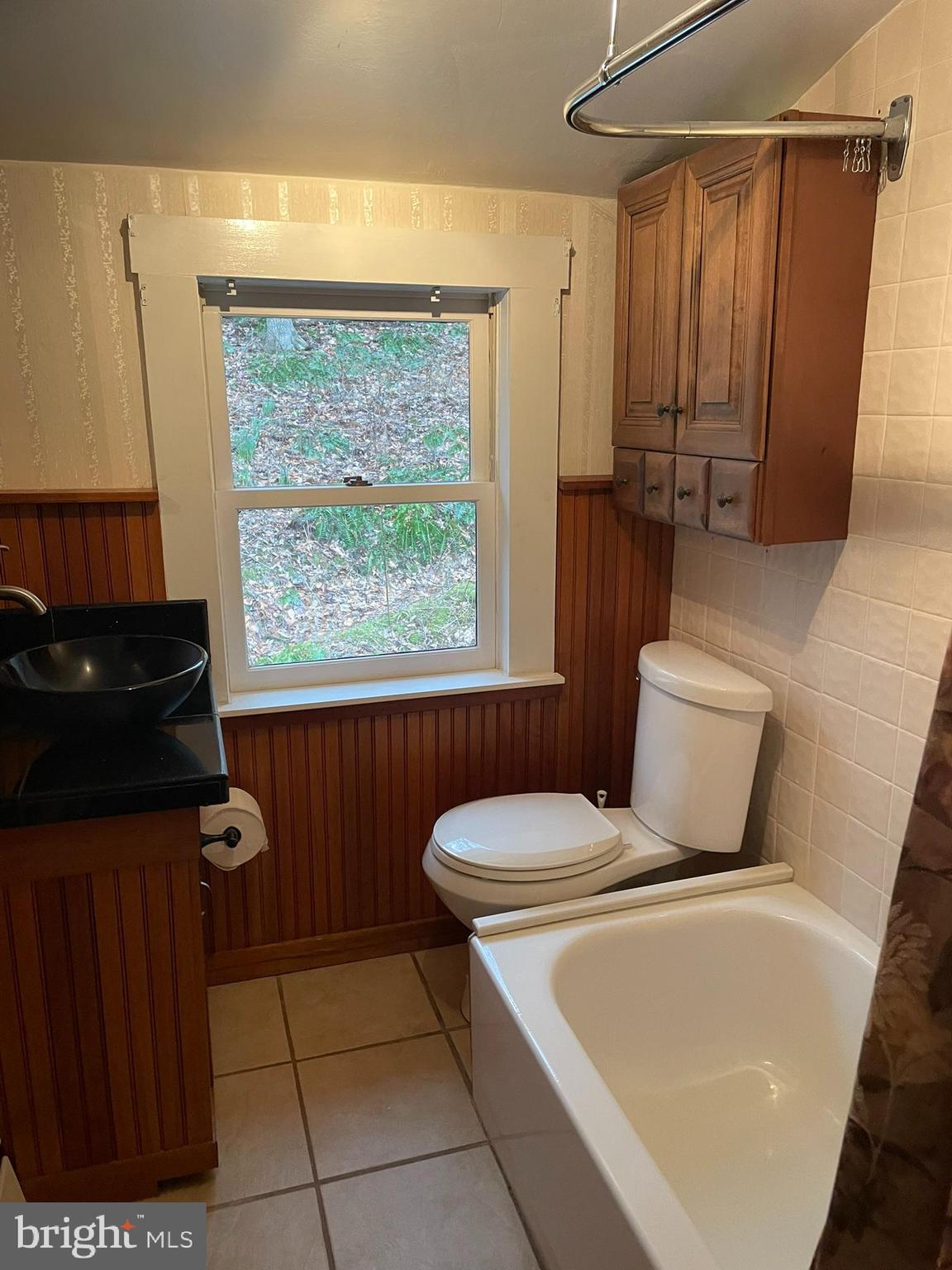 1127 Kaolin Road Avondale, PA 19311 - Photo 24 of 31 a bathroom with a toilet a sink and a window