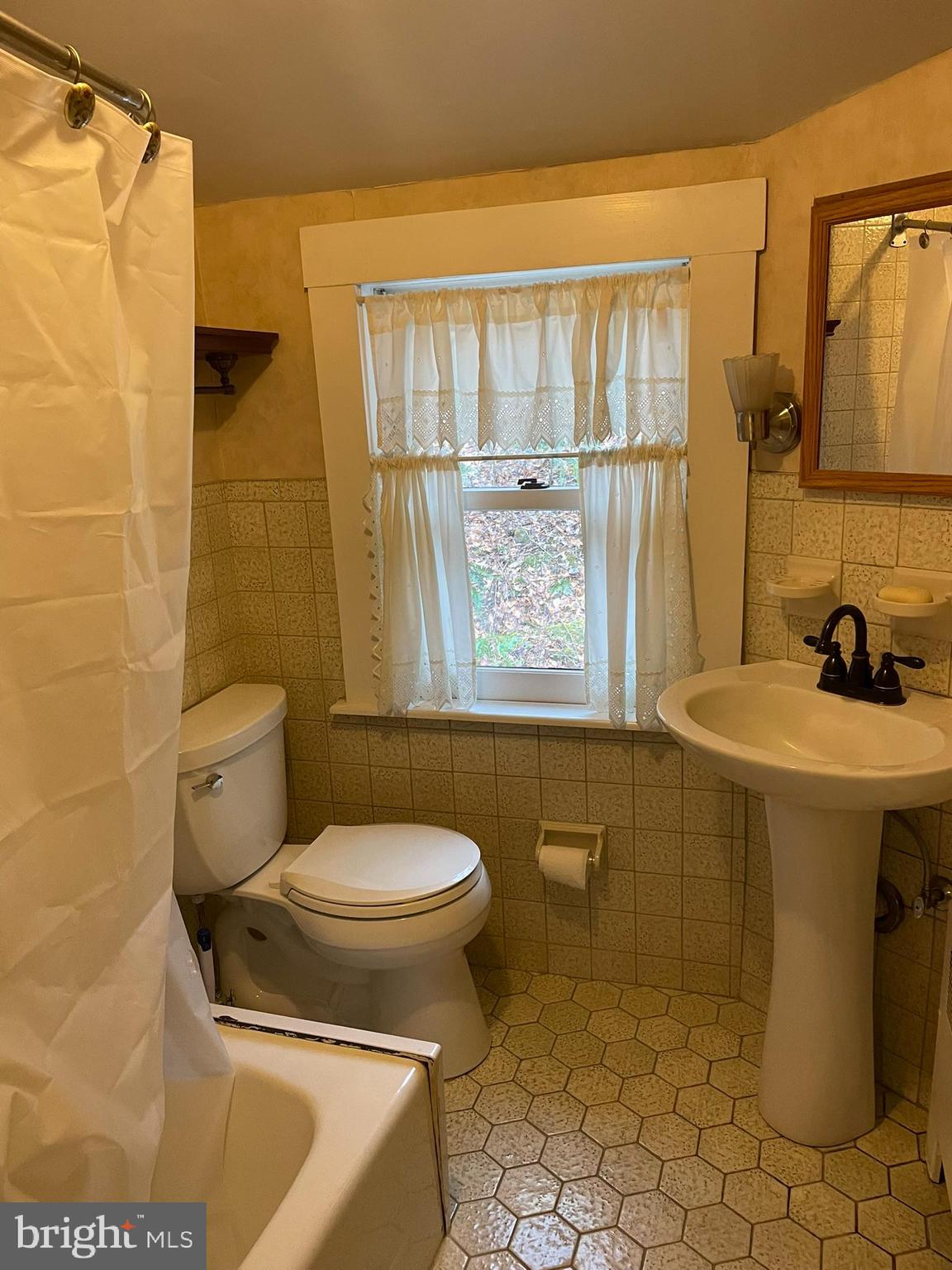 1127 Kaolin Road Avondale, PA 19311 - Photo 25 of 31 a bathroom with a sink toilet and shower