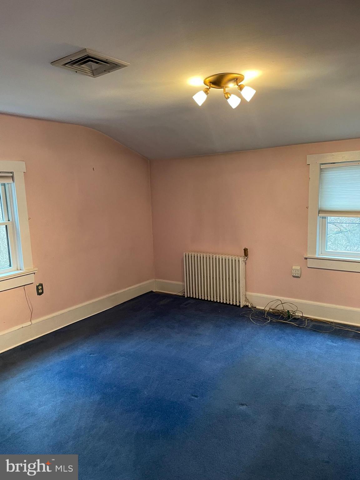 1127 Kaolin Road Avondale, PA 19311 - Photo 27 of 31 a view of an empty room with a window and wooden floor