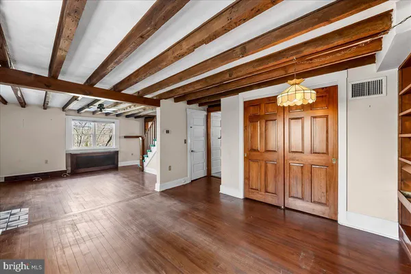 a living room with furniture and floor to ceiling windows
