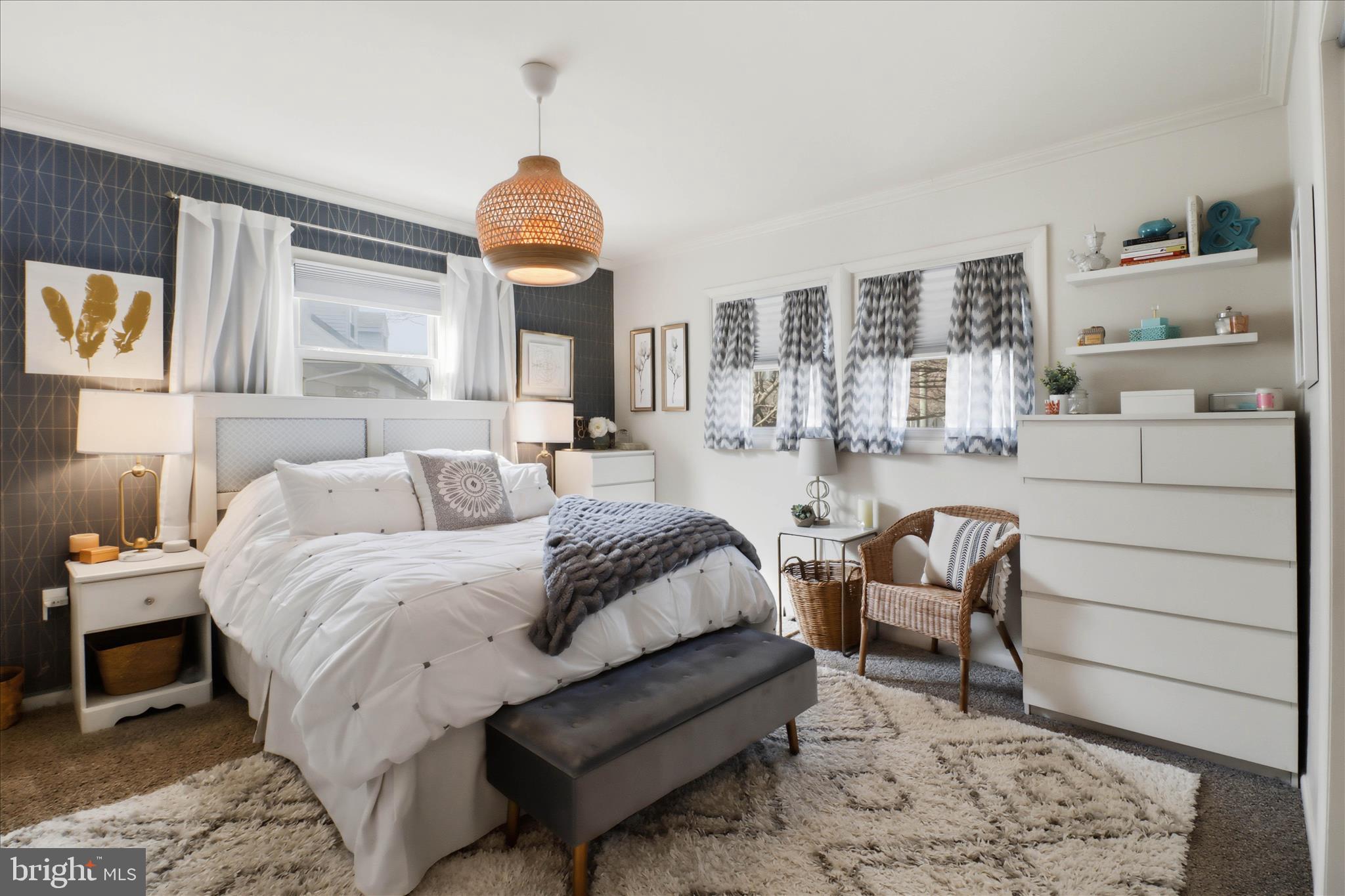 213 Skylark Road Lititz, PA 17543 - Photo 17 of 54 a spacious bedroom with a bed a couch and large window