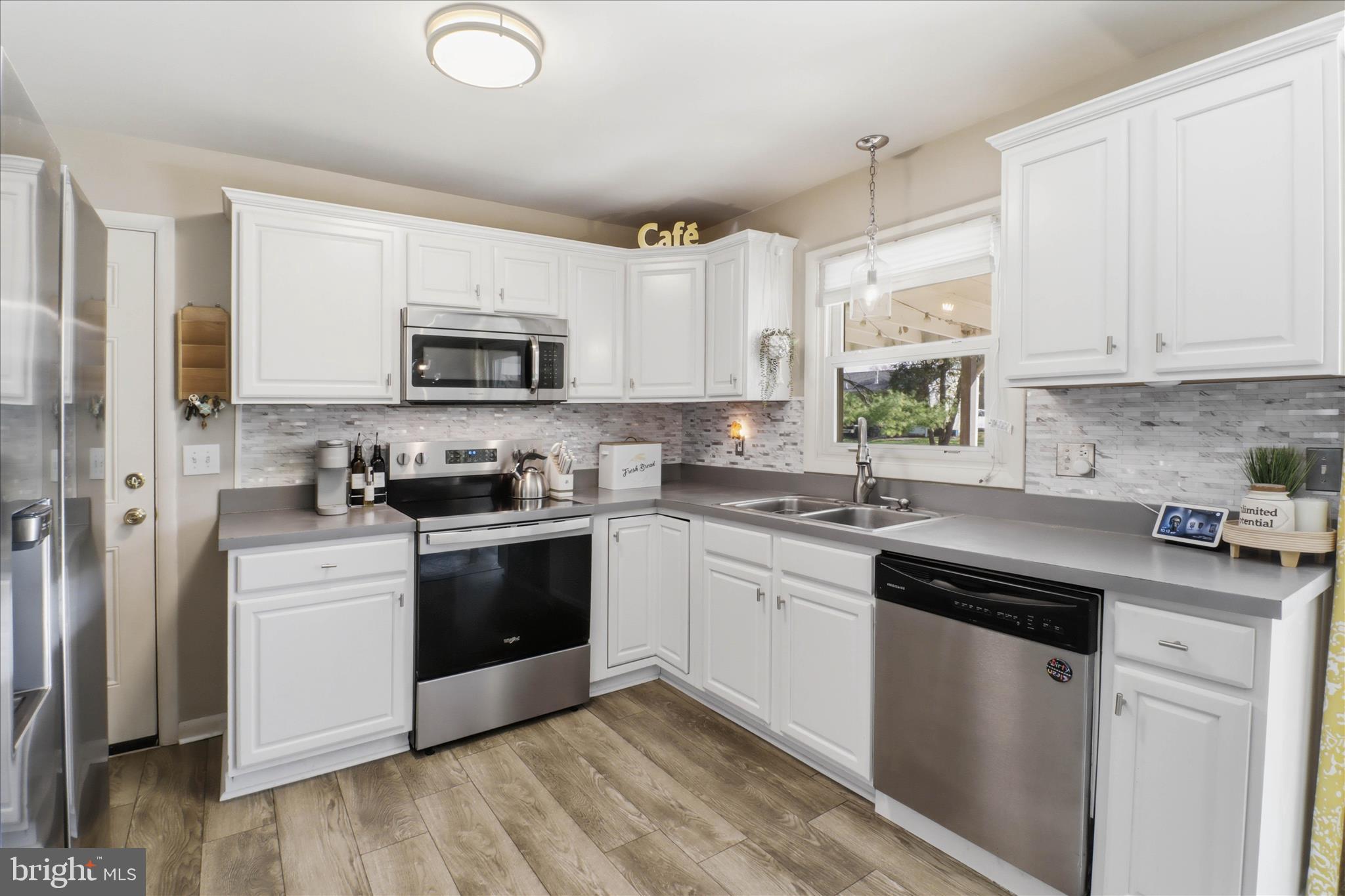 213 Skylark Road Lititz, PA 17543 - Photo 9 of 54 a kitchen with granite countertop white cabinets and white appliances