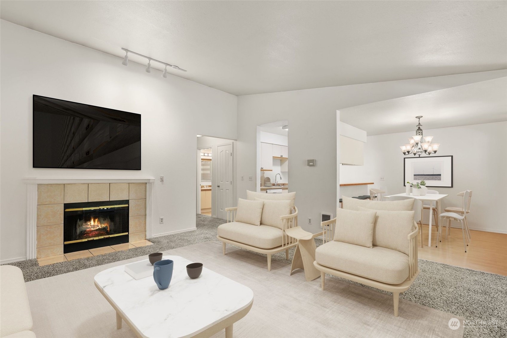 a living room with furniture a fireplace and a flat screen tv