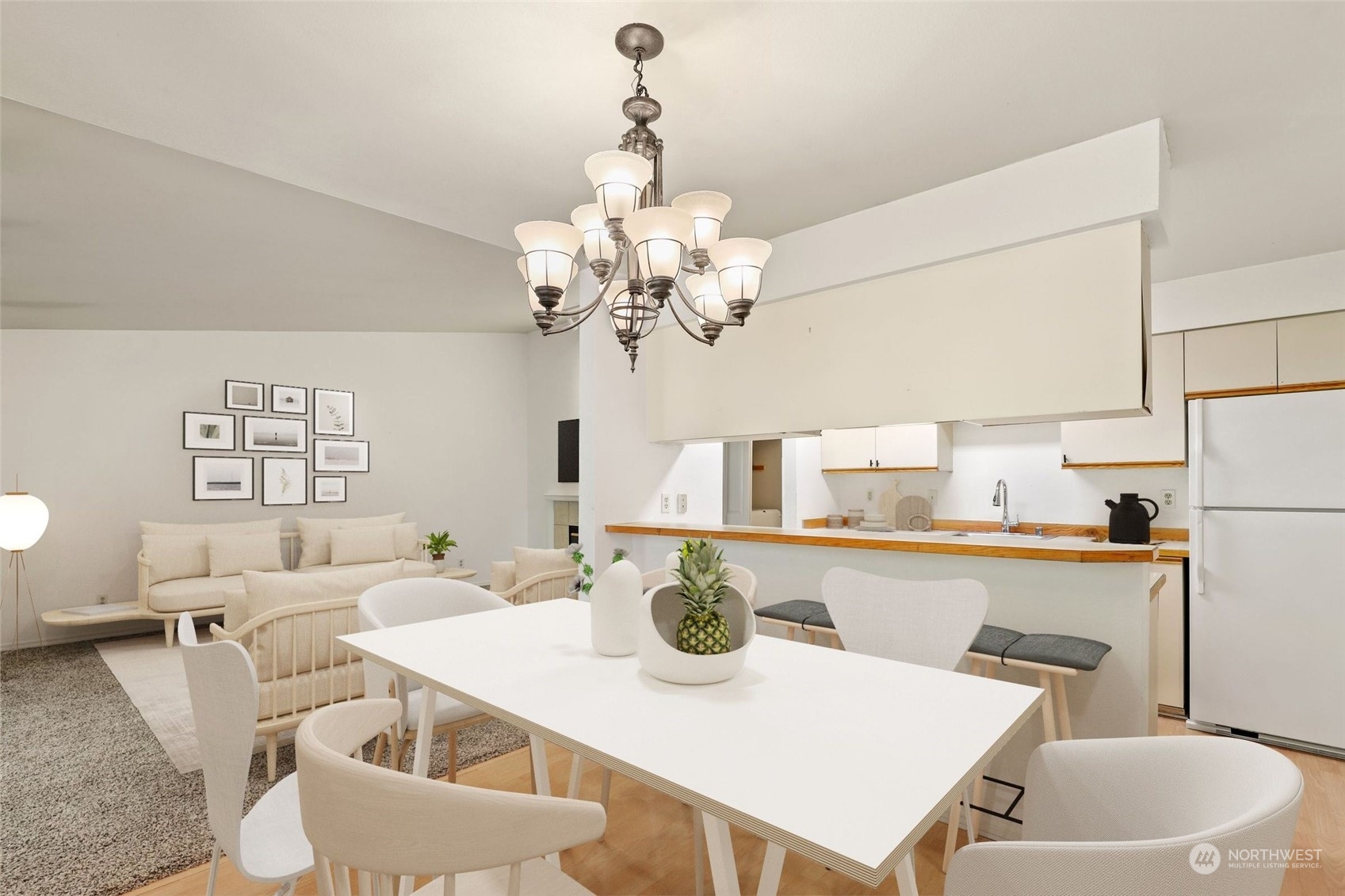 1830 South 336th Street, Unit C201 Federal Way, WA 98003 - Photo 11 of 30 a dining room with furniture a chandelier and a table