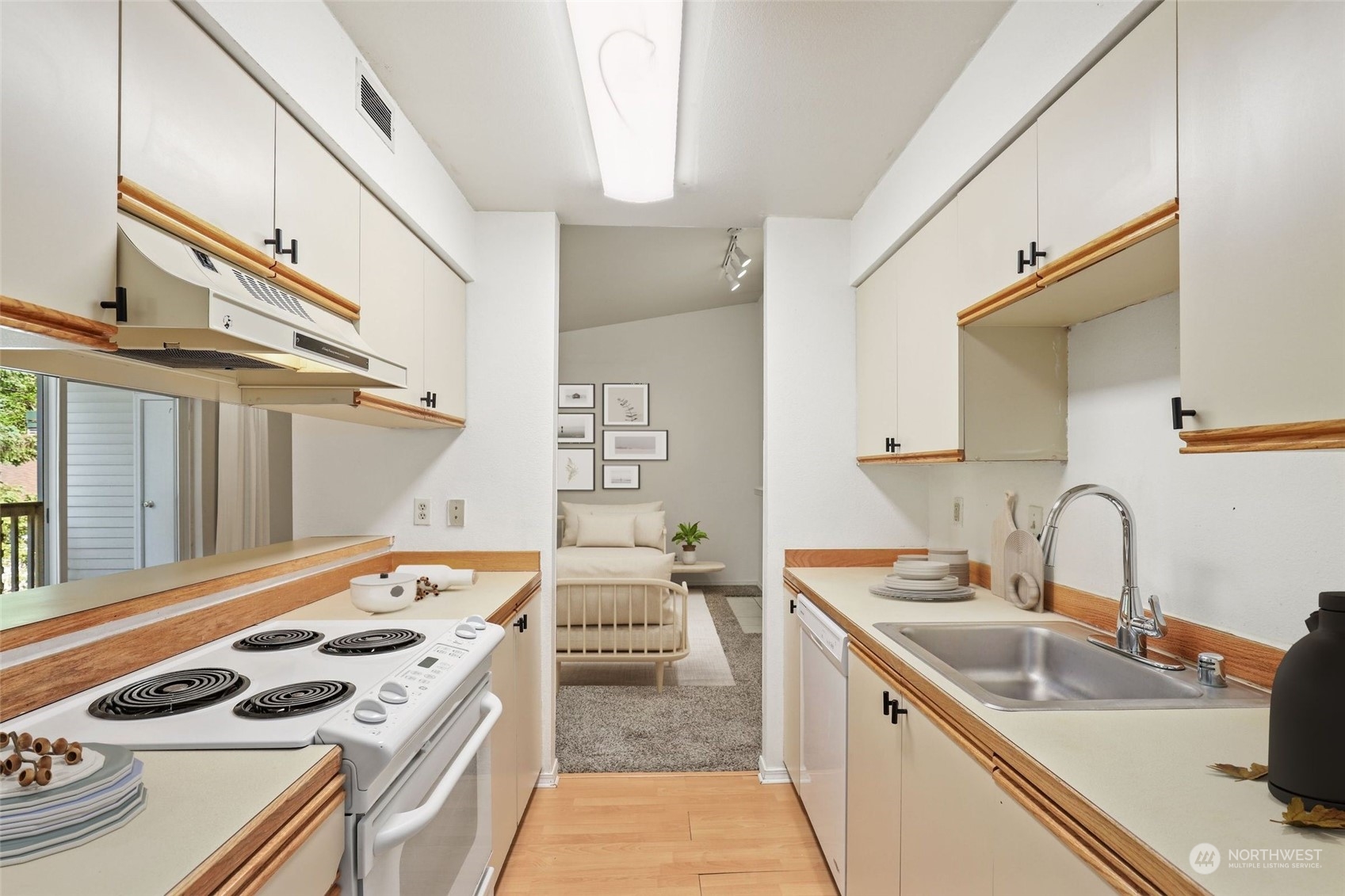 1830 South 336th Street, Unit C201 Federal Way, WA 98003 - Photo 14 of 30 a kitchen that has a sink and a stove