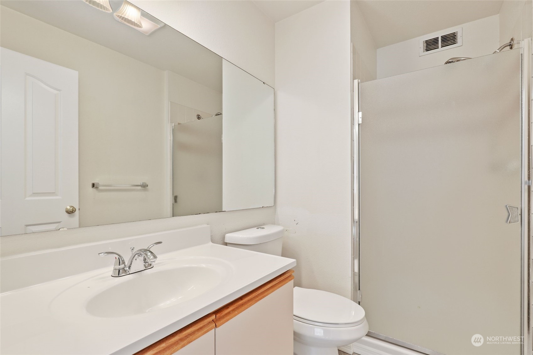 1830 South 336th Street, Unit C201 Federal Way, WA 98003 - Photo 17 of 30 a bathroom with a sink toilet and a mirror