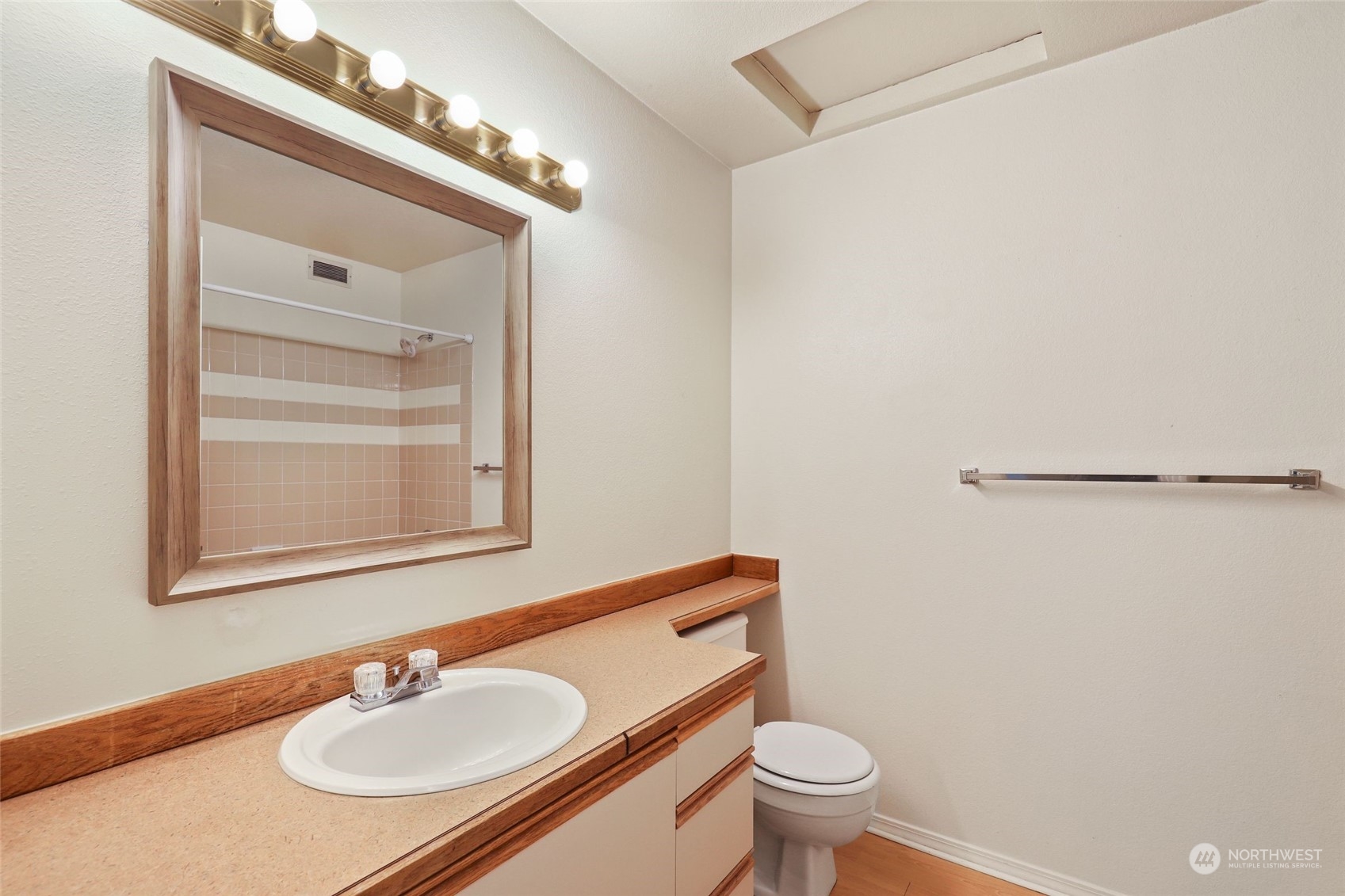 1830 South 336th Street, Unit C201 Federal Way, WA 98003 - Photo 20 of 30 a bathroom with a sink toilet and mirror