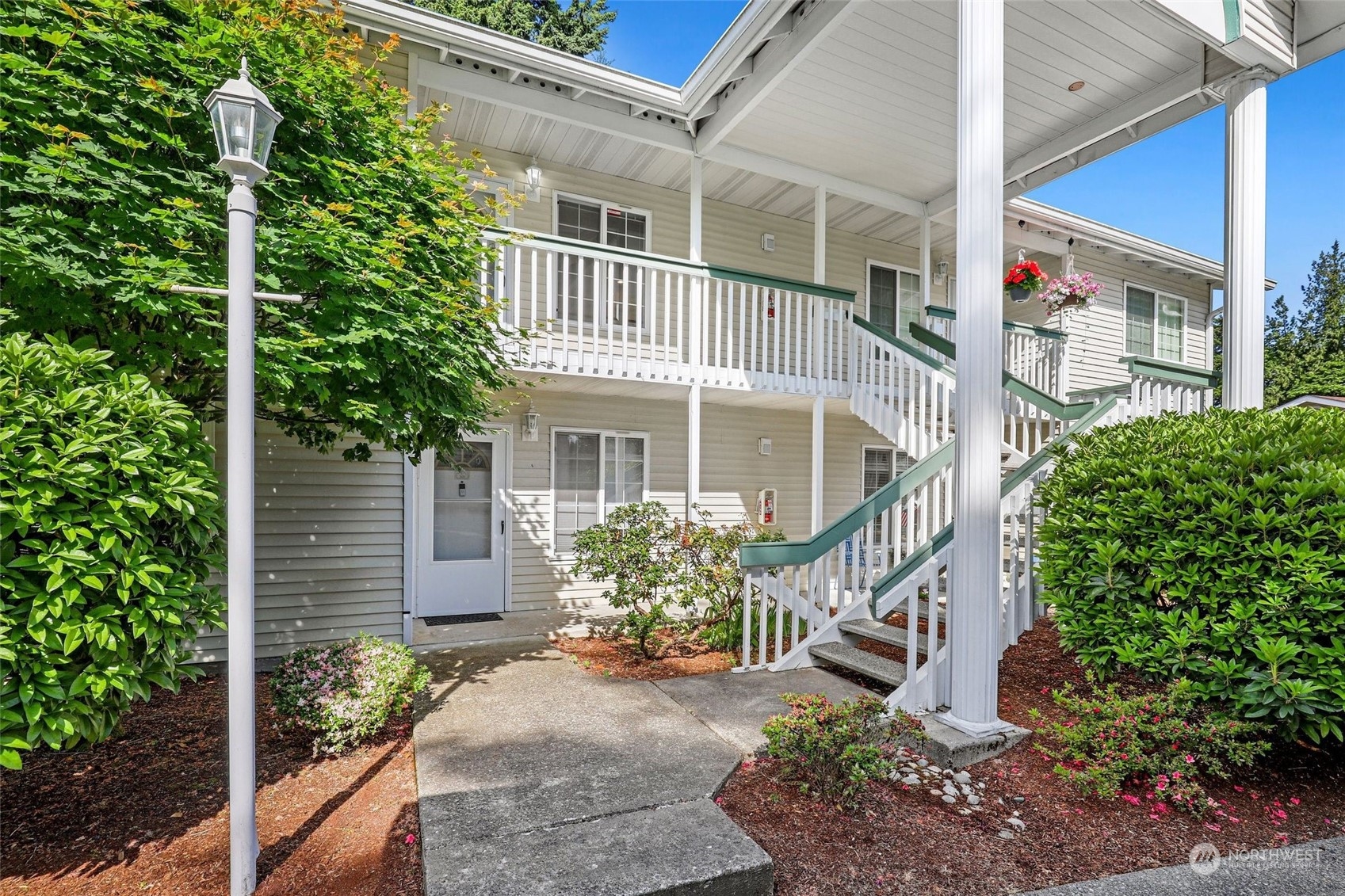 1830 South 336th Street, Unit C201 Federal Way, WA 98003 - Photo 2 of 30 a front view of a house with a yard