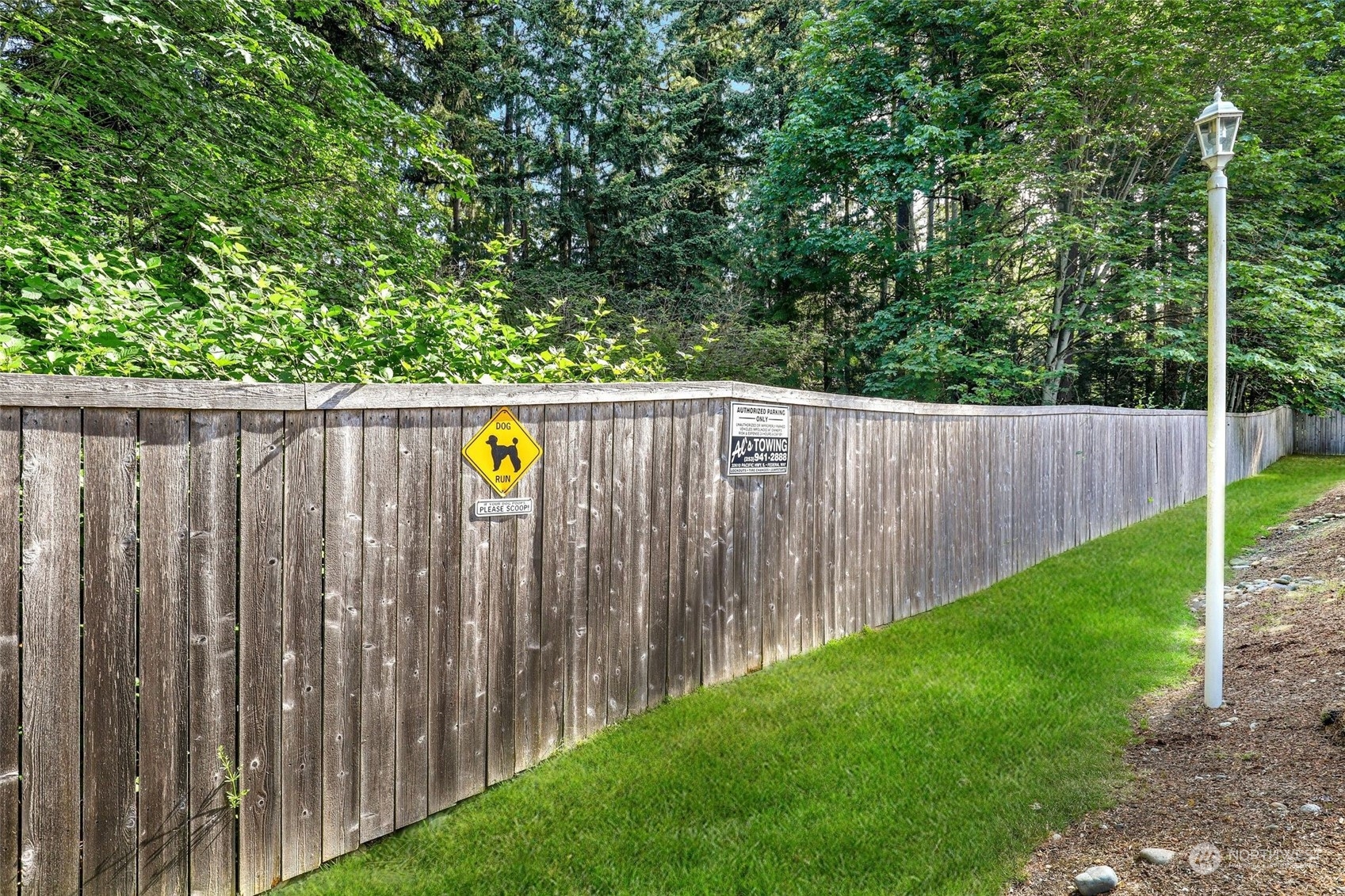 1830 South 336th Street, Unit C201 Federal Way, WA 98003 - Photo 23 of 30 a view of a backyard with wooden fence